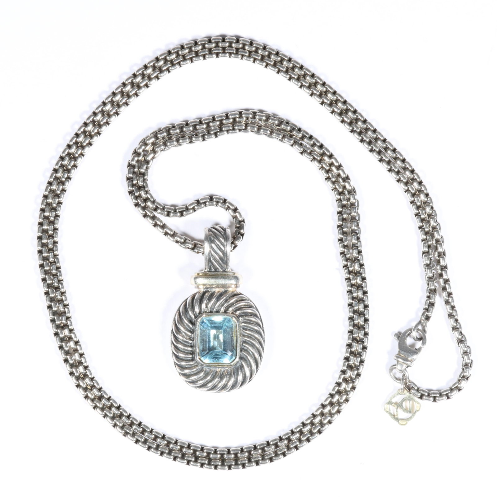 David Yurman sterling silver Albion cable pendant necklace with blue topaz and 14K yellow gold DY: David Yurman sterling silver Albion cable pendant necklace with blue topaz and 14K yellow gold DY logo charm, with original box and cleaning cloth The DY logo charm at the clasp is 14K yellow gold. 32