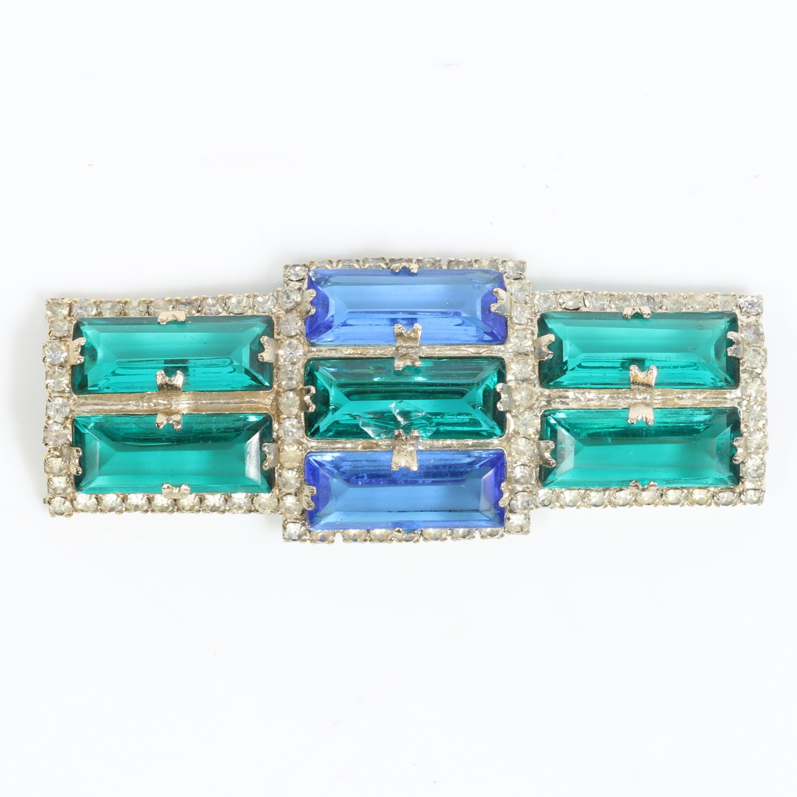 William De Lillo vintage emerald and sapphire toned brooch with crystal rhinestones 2 7/8"W x 1: William De Lillo vintage emerald and sapphire toned brooch with crystal rhinestones Chip on center stone 2 7/8"W x 1 1/8"L
