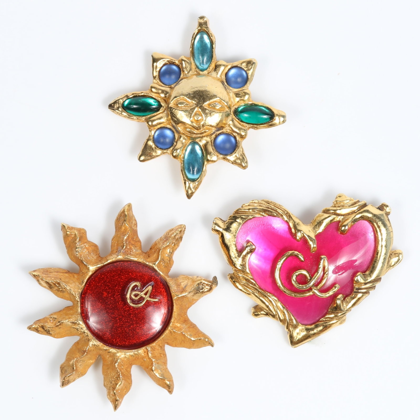 Christian LaCroix French designer 3pc gold-tone brooches with sunburst gold, pink, blue, and green: Christian LaCroix French designer 3pc gold-tone brooches with sunburst gold, pink, blue, and green tones Provenance: From the private collection of Dr. Claudia Brodhead 2 1/2"H x 2 1/4"W