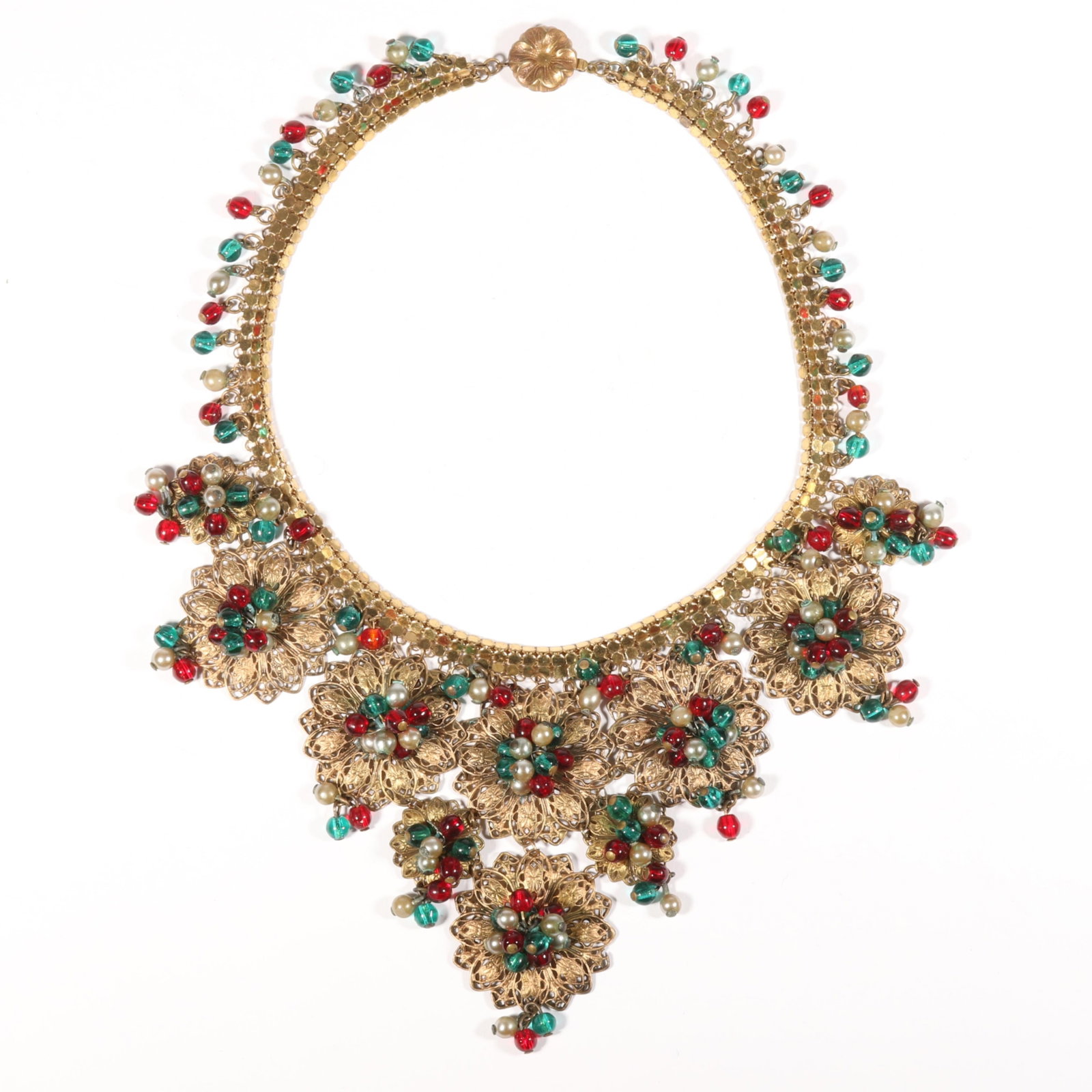 Early Miriam Haskell 1930's gilt filigree and Gripoix glass festoon bib necklace with green and red: Early Miriam Haskell 1930's gilt filigree and Gripoix glass festoon bib necklace with green and red glass beads and faux pearl dangles, unsigned Some oxidation to beads Provenance: From the Collection