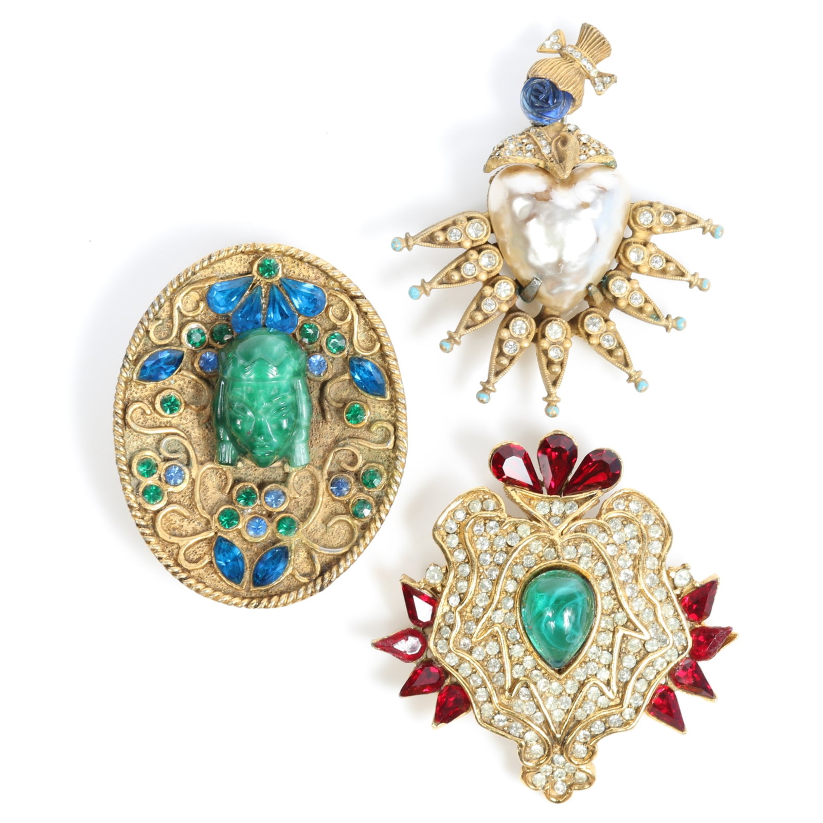 Hattie Carnegie 3pc brooch group: Asian princess with a molded green glass face surrounded by blue: Hattie Carnegie 3pc brooch group: Asian princess with a molded green glass face surrounded by blue and green rhinestones, faux baroque pearl body and a blue rosebud head beneath a pixie top-knot, and 