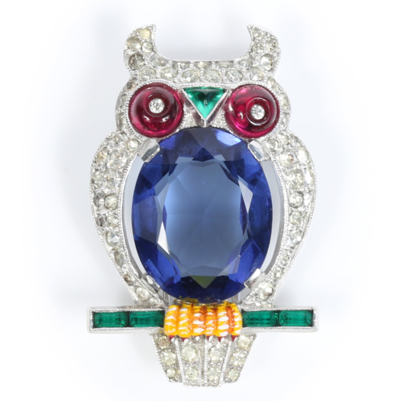 Trifari Alfred Philippe 1941 owl on perch book piece pin clip with faceted blue crystal jewel belly,: Trifari Alfred Philippe 1941 owl on perch book piece pin clip with faceted blue crystal jewel belly, shoe button glass eyes and pave rhinestones American Costume Jewelry Vol. 2 by Carla Ginelli Brunia