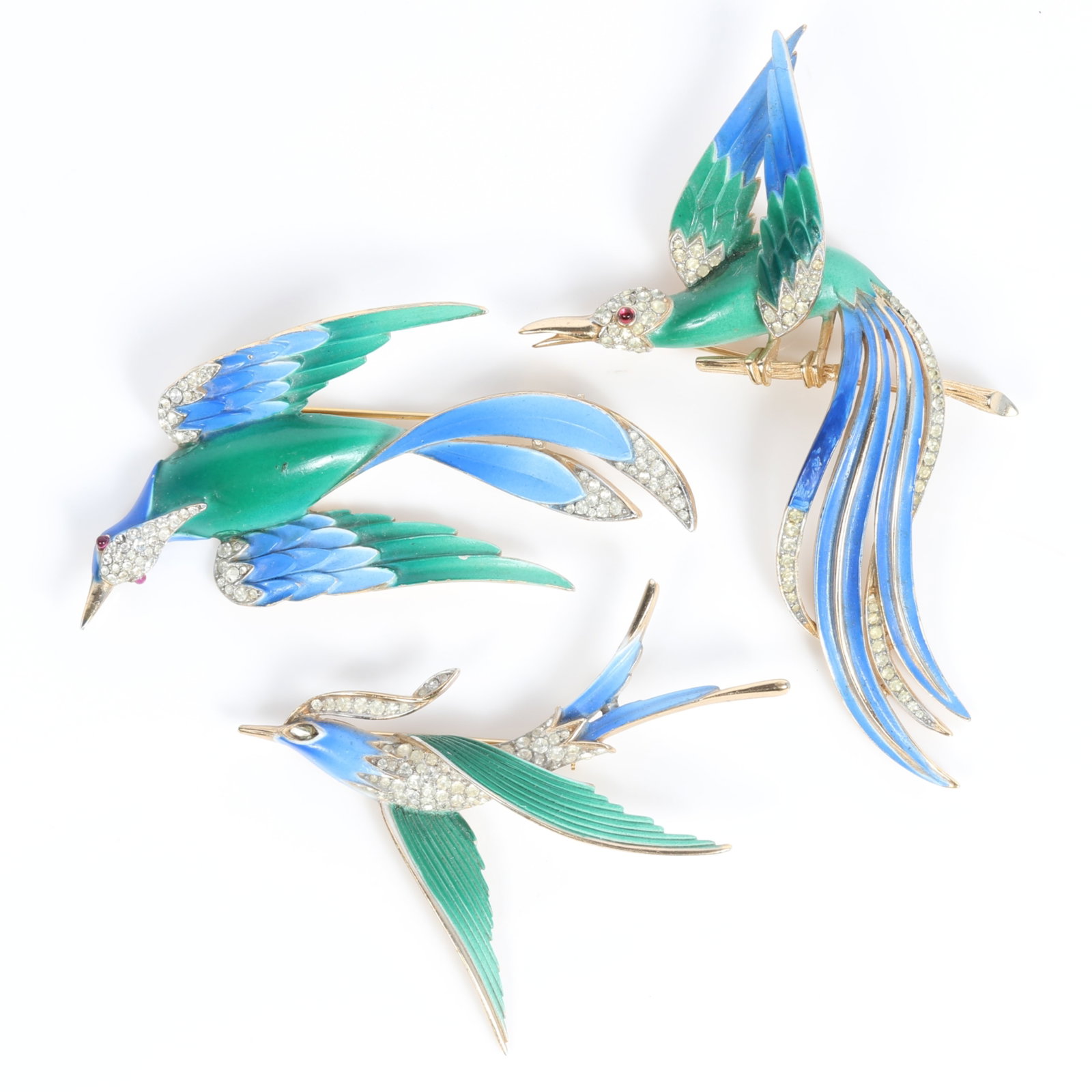 Crown Trifari 3pc blue and green enameled birds of paradise brooch group with rhinestone crystal: Crown Trifari 3pc blue and green enameled birds of paradise brooch group with rhinestone crystal accents Two rhinestones missing. One on a wing and one eye. 3 6/8"H x 2 1/2"W