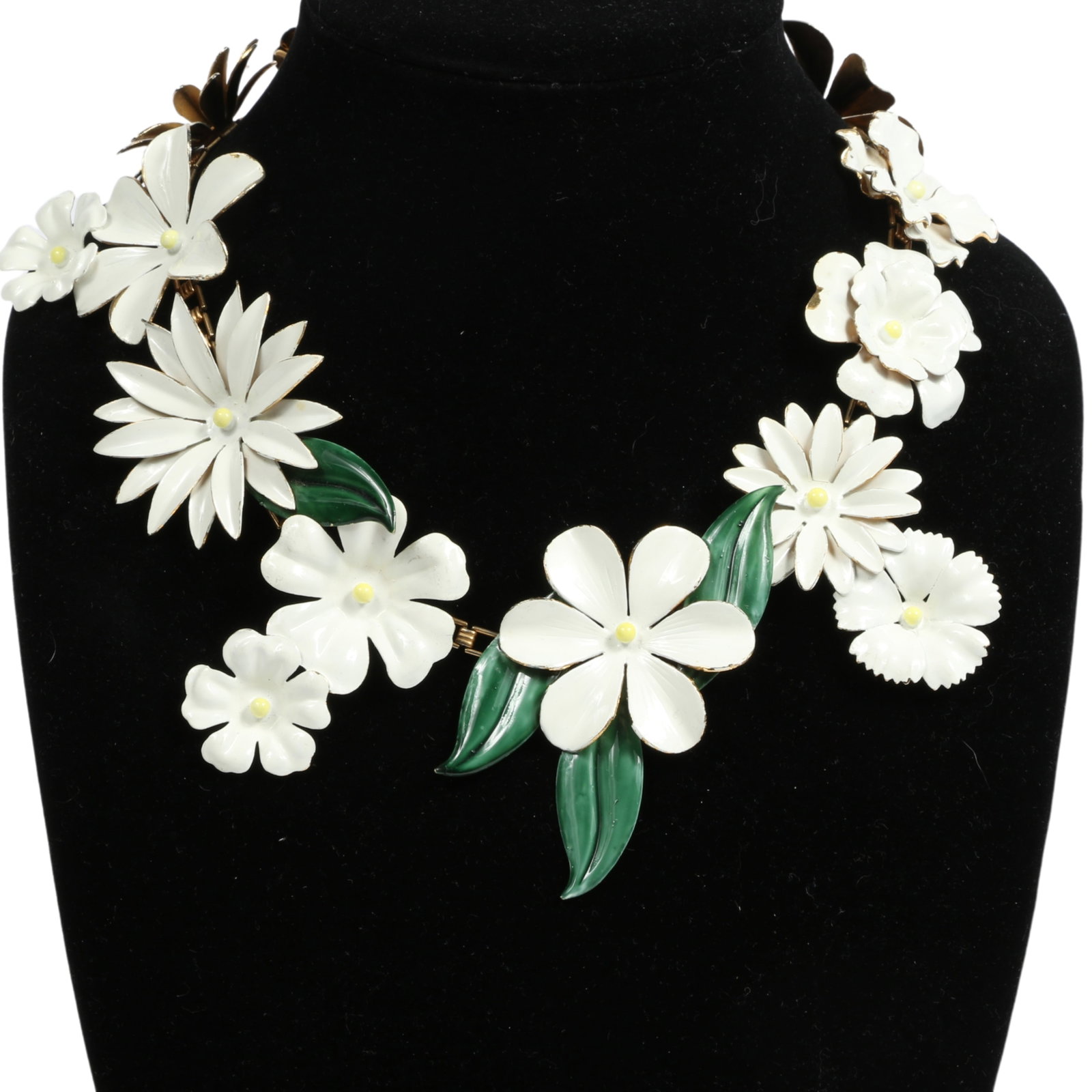 Sandor all white enamel flower necklace with little yellow centers and green accent leaves 17 1/2"L: Sandor all white enamel flower necklace with little yellow centers and green accent leaves Provenance: From the private collection of Dr. Claudia Brodhead 17 1/2"L - 19"L adjustable x 2 3/4"W