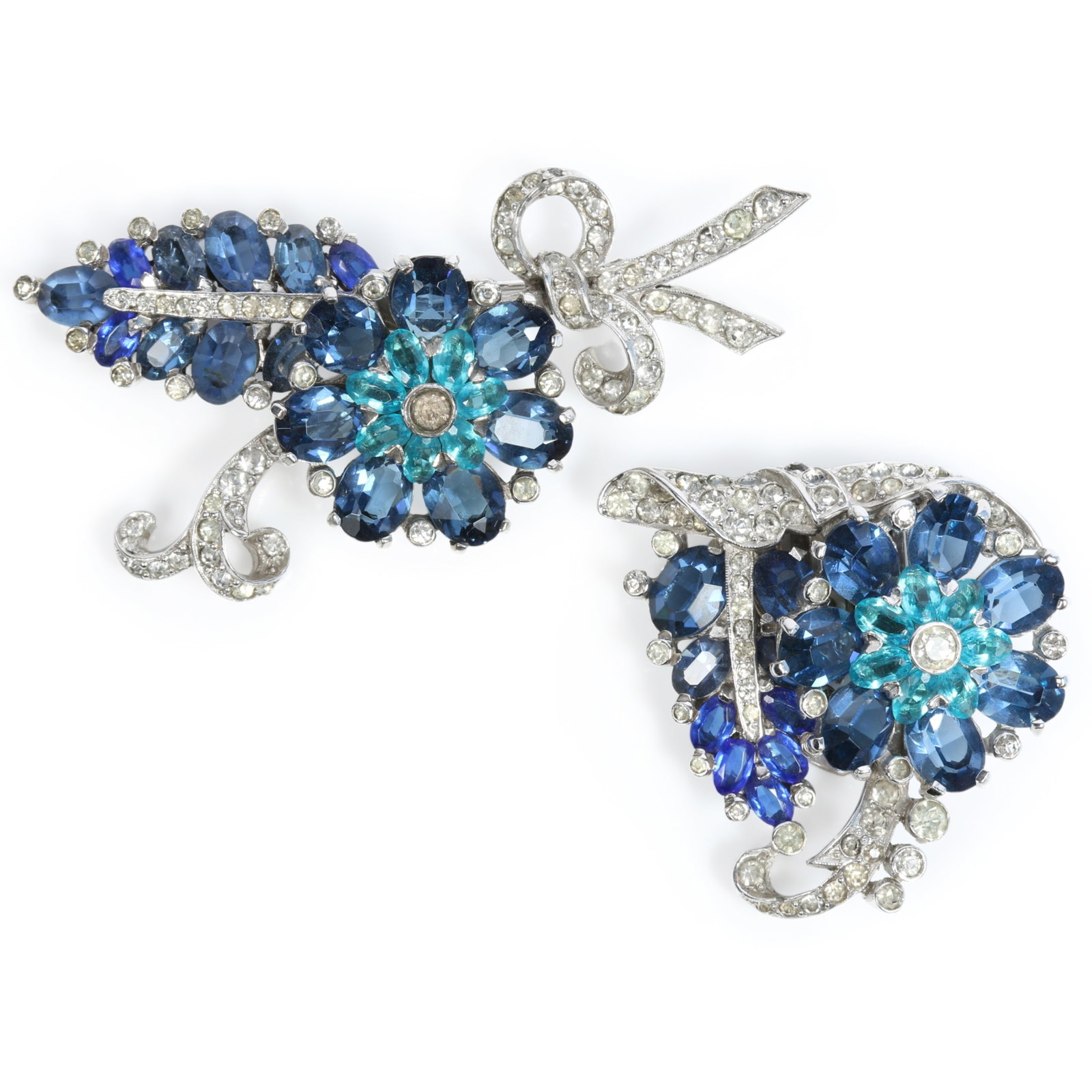 Mazer floral brooch and matching dress clip with blue crystal blossoms and pav? rhinestone foliage 2: Mazer floral brooch and matching dress clip with blue crystal blossoms and pav? rhinestone foliage Provenance: From the private collection of Dr. Claudia Brodhead 2 5/8 x 1 1/4"W
