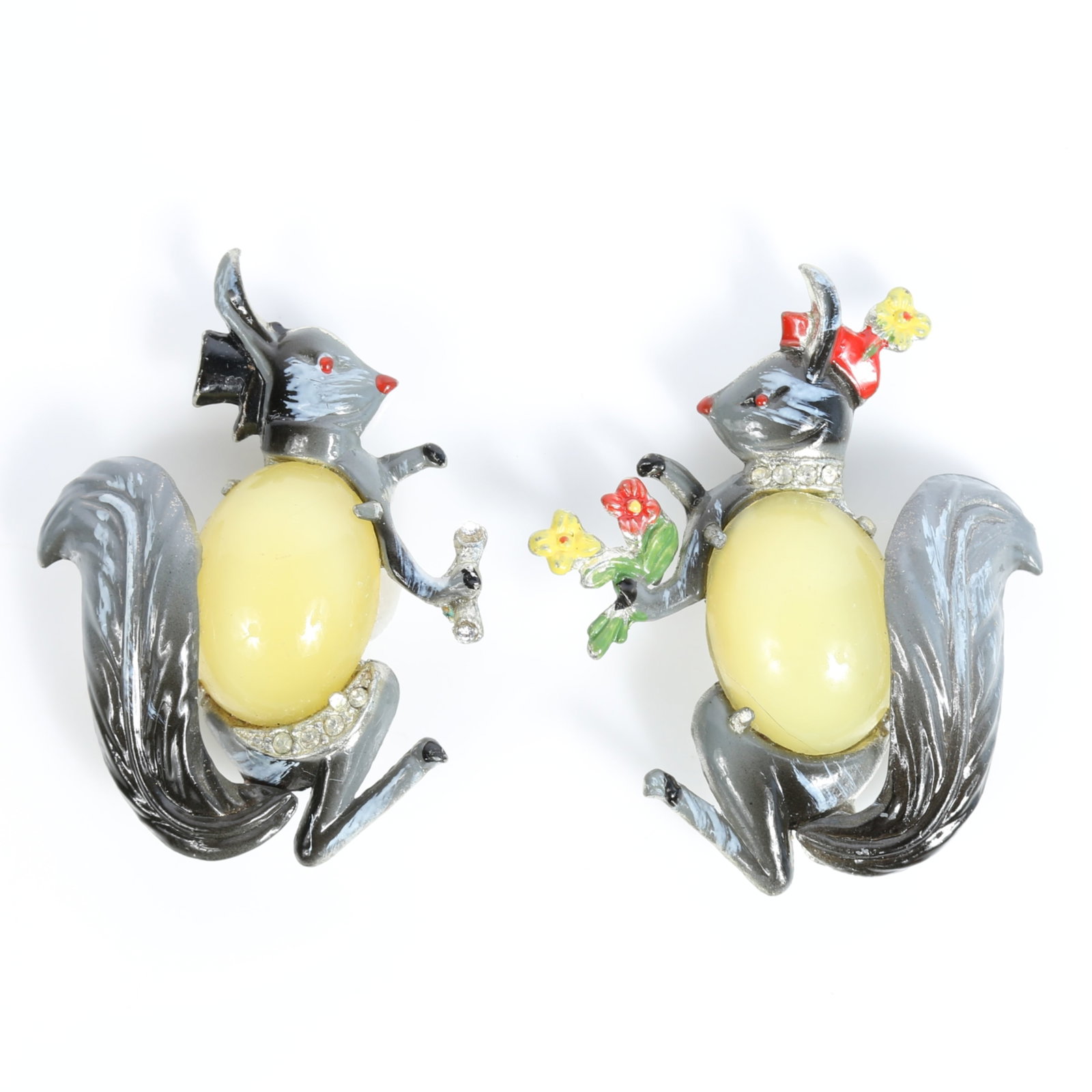 Coro 1941 "Mr. & Mrs. Squirrel" Gene Verrecchio brooches with yellow glass belly cabochons, pave: Coro 1941 "Mr. & Mrs. Squirrel" Gene Verrecchio brooches with yellow glass belly cabochons, pave rhinestone crystals, and enameling Provenance: From the Collection of Joan Duran, owner of The Queen's 