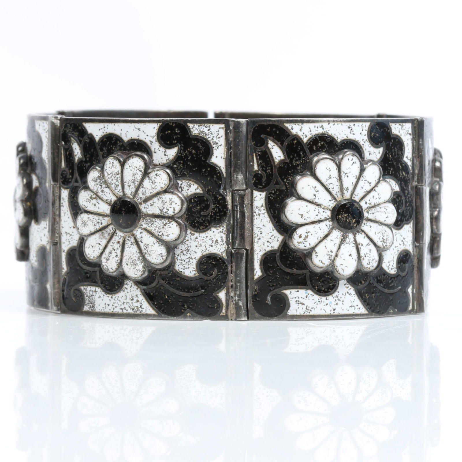 Margot de Taxco Mexican sterling silver black and white layered enamel floral daisy panel bracelet: Margot de Taxco Mexican sterling silver black and white layered enamel floral daisy panel bracelet Provenance: From the private collection of Dr. Claudia Brodhead 7"L x 1 1/4"W