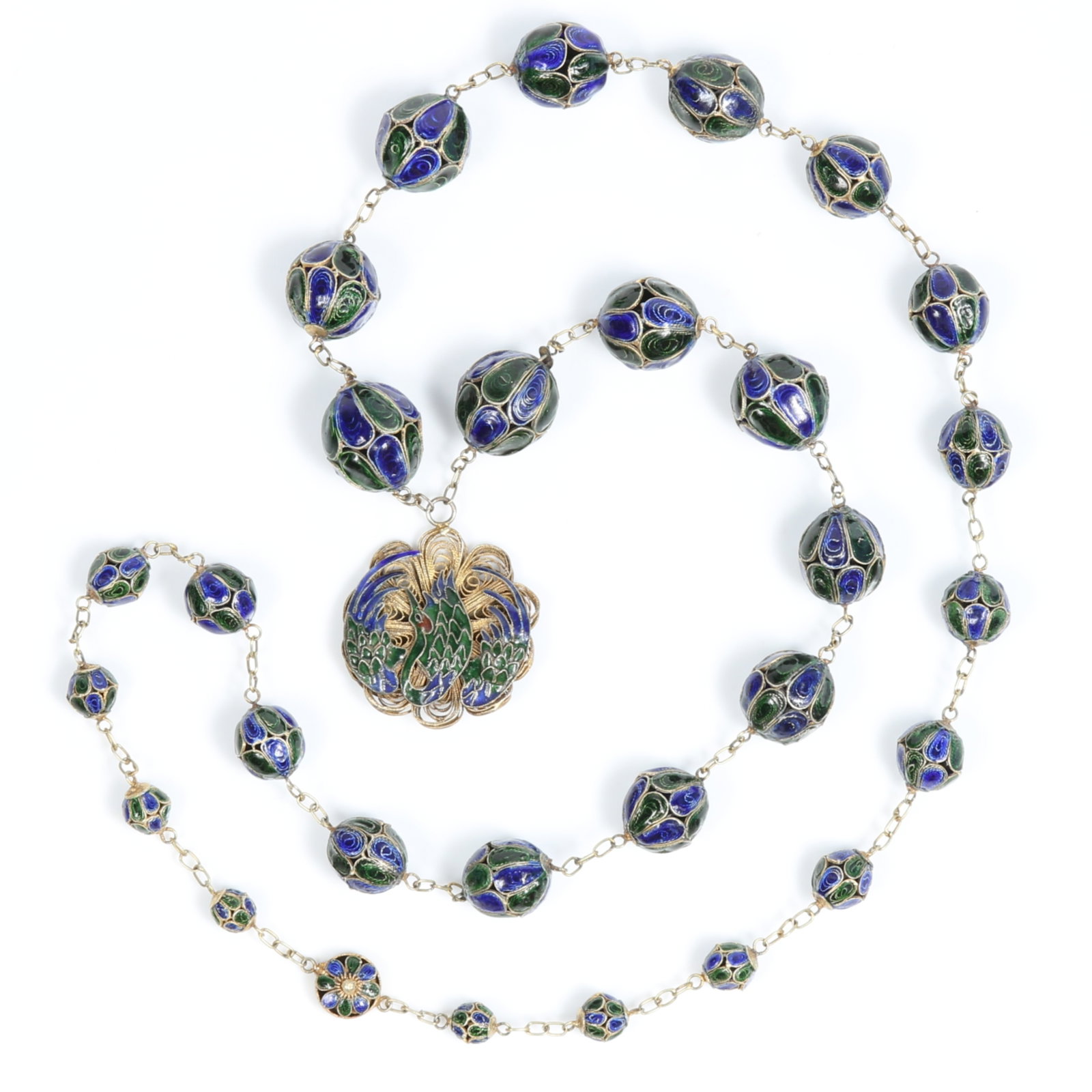 Chinese Export rich blue and green enamel necklace depicting stylized peacock 30"L X 1 1/2" Drop: Chinese Export rich blue and green enamel necklace depicting stylized peacock Provenance: From the private collection of Dr. Claudia Brodhead 30"L X 1 1/2" Drop