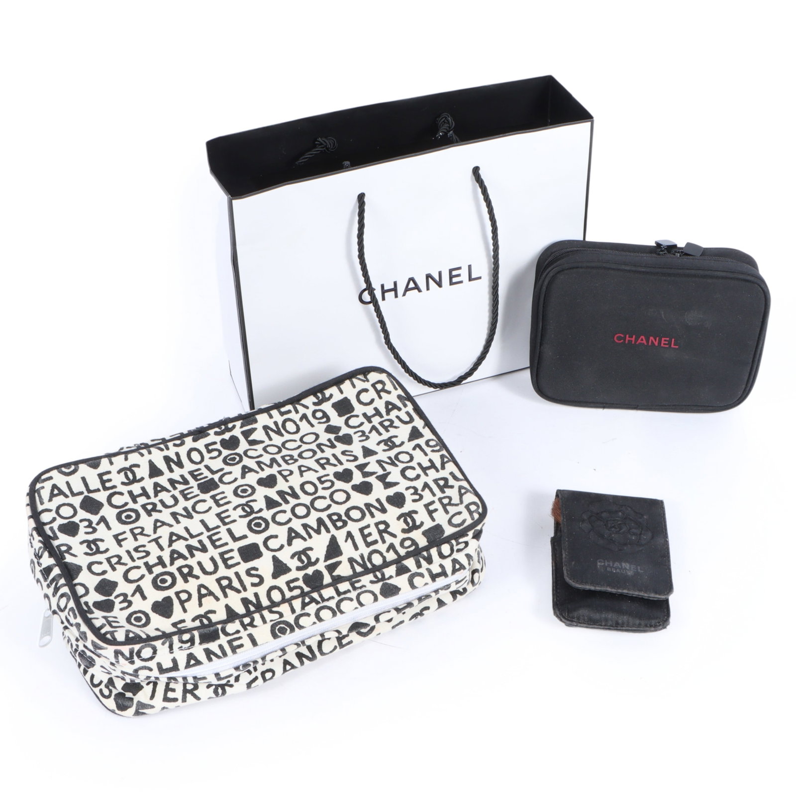4pc. collection of Chanel cosmetic items 3"H x 10"W x 6"D (black and white cosmetics bag) (1 of 17)