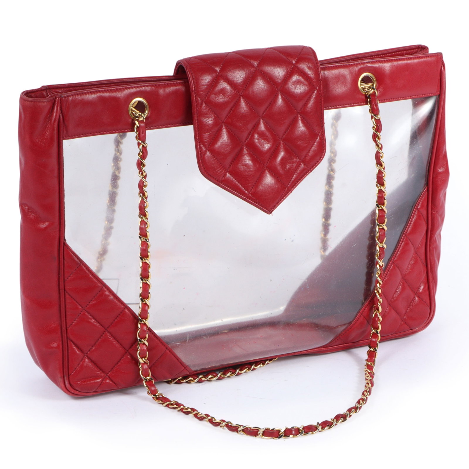 1990s Chanel red leather PVC shoulder bag tote 11"H x 15"W x 3"D(body), 15 1/2"Handle drop: 1990s Chanel red leather PVC shoulder bag tote This bag features red leather and clear PVC panels with gold tone hardware. It features Chanel's classic red woven leather chain handles. Missing authent