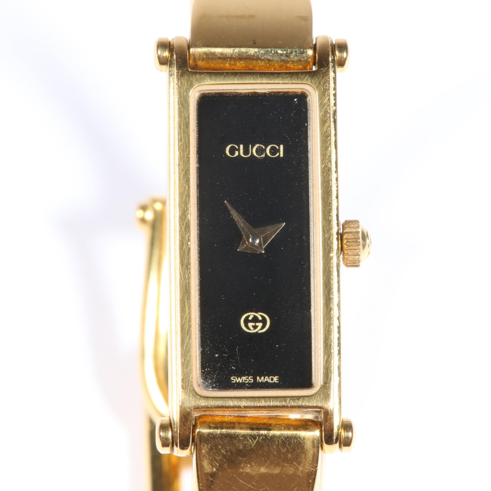 Women's Gucci 1500L Quartz Bangle Wristwatch with Horsebit Clasp; gold plated and Black Dial 1/2"W x: Women's Gucci 1500L Quartz Bangle Wristwatch with Horsebit Clasp; gold plated and Black Dial Not running. The hands move freely. The dial has the interlocking G's logo and Swiss Made. The back of the 