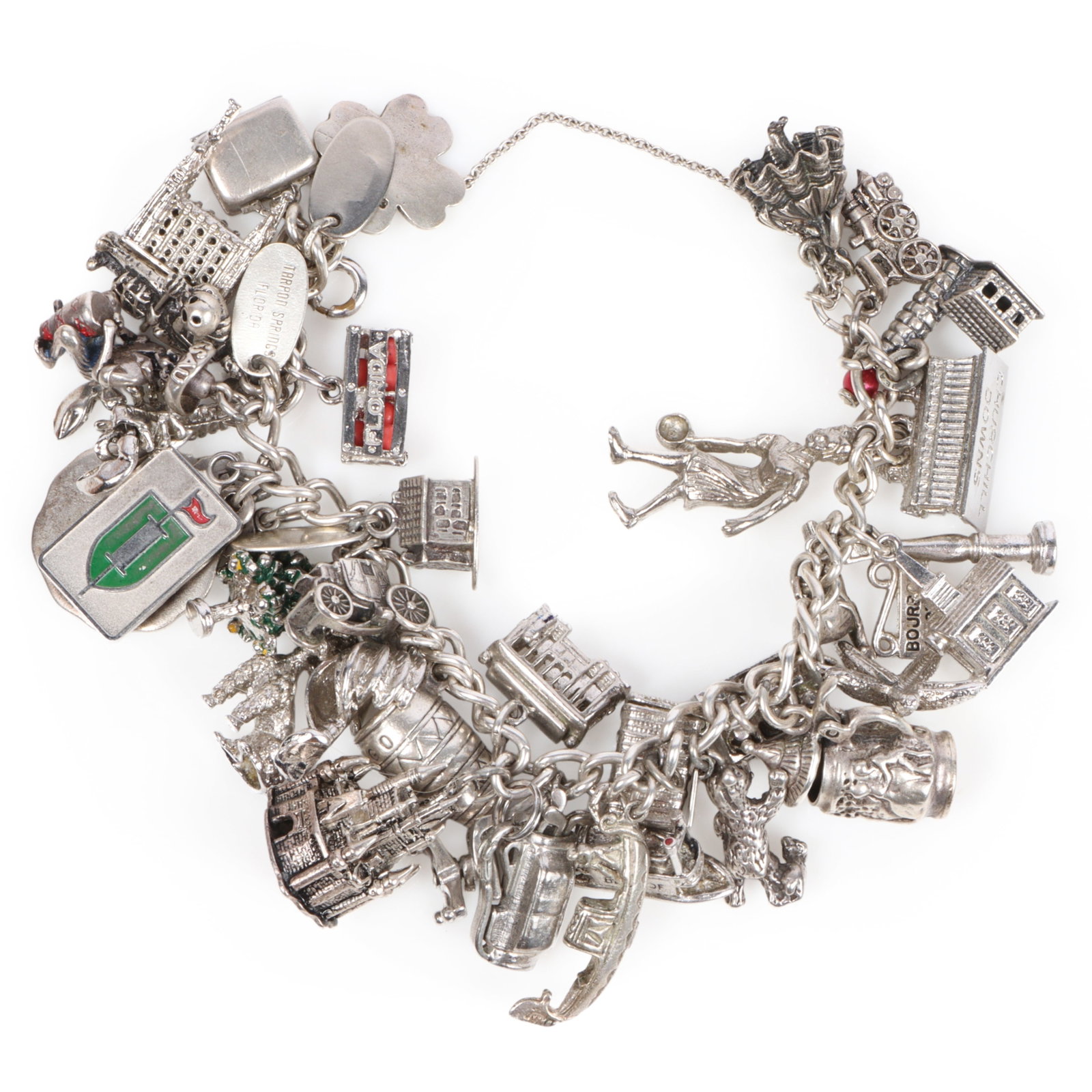 Vintage sterling silver bracelet with over 35 charms including some sterling and mechanical charms,: Vintage sterling silver bracelet with over 35 charms including some sterling and mechanical charms, European and American souvenir pieces. 7"Long