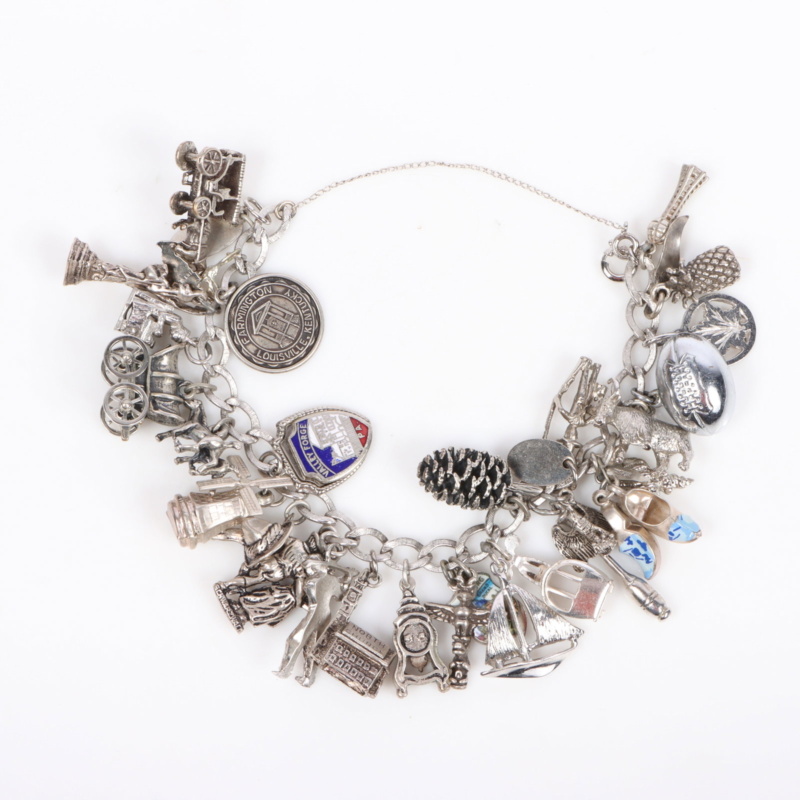 charm bracelet with over 30 charms inlcuding some sterling charms 6 1/4"Long (1 of 6)