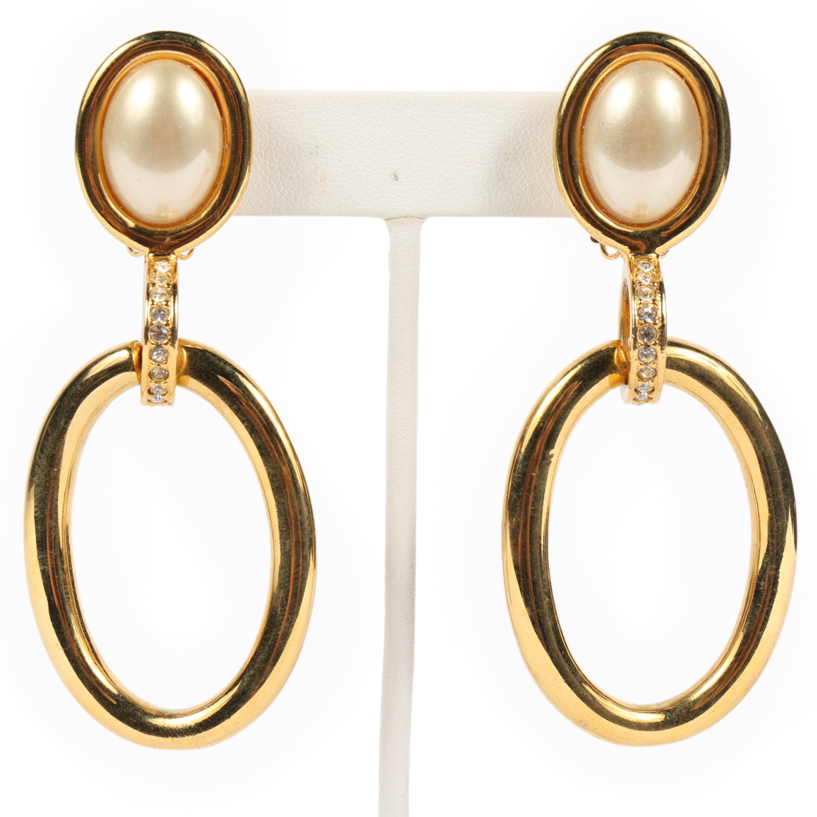 Valentino clip on drop hoop earrings with faux pearls and rhinestones 3"H x 1 1/4"W each: Valentino clip on drop hoop earrings with faux pearls and rhinestones Provenance: From the private collection of Dr. Claudia Brodhead 3"H x 1 1/4"W each