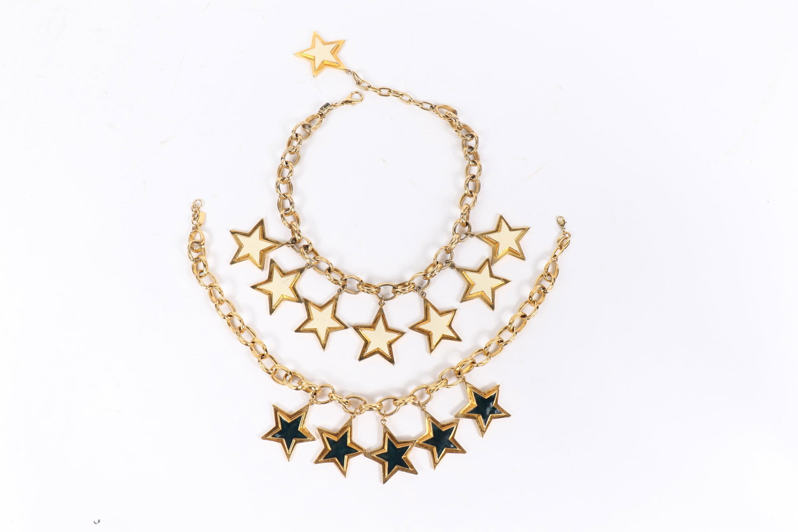 Escada white and blue enameled star statement necklaces 21"L white star necklace: Escada white and blue enameled star statement necklaces This pair includes a white enamelled necklace features 8 enameled stars hanging from a gold tone curb chain. Also included is a second Escada ne