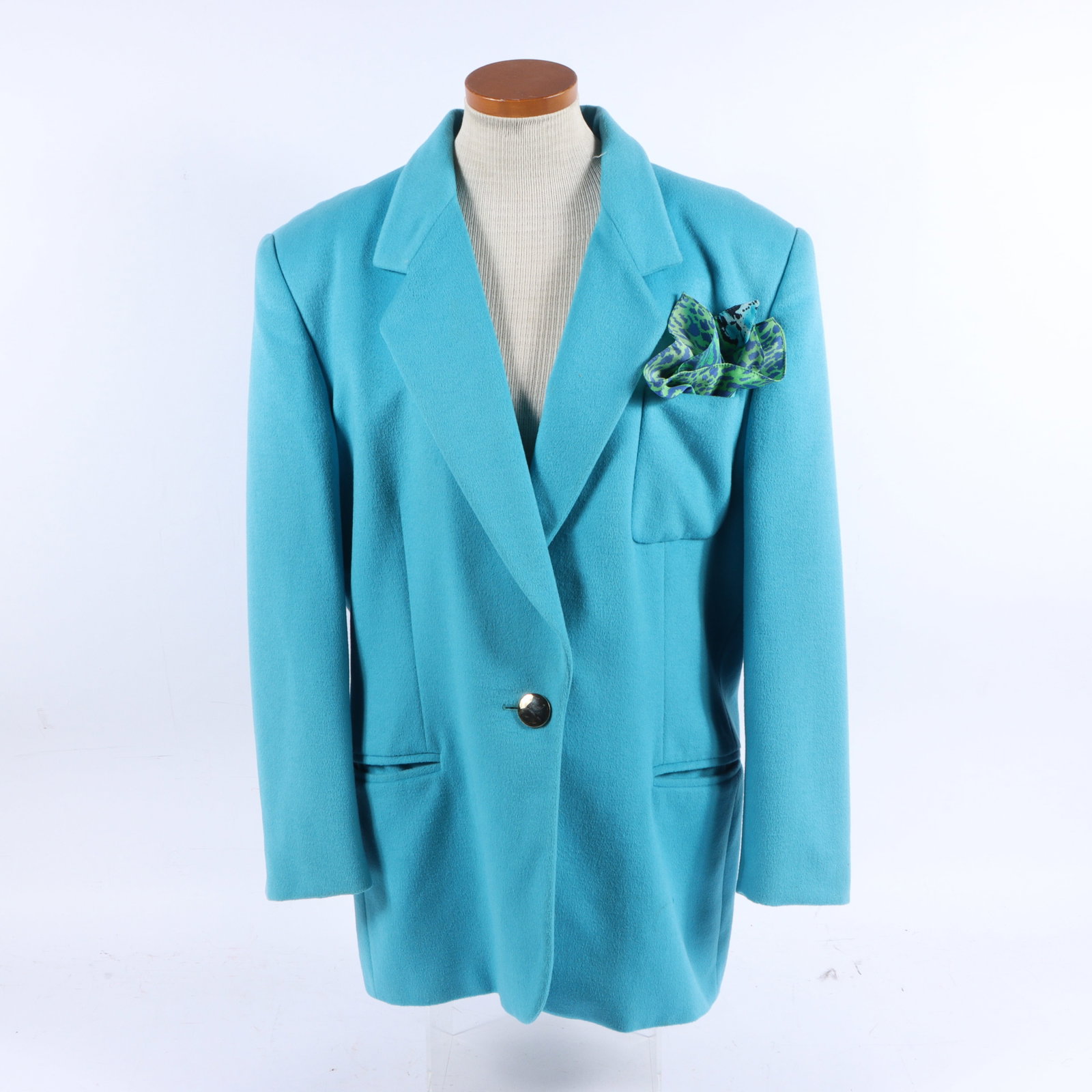 Escada by Margaretha Ley bright blue longline wool blazer coat 22" pit to pit, 19" center front to: Escada by Margaretha Ley bright blue longline wool blazer coat A vibrant blue women's blazer by Escada, featuring a single gold button closure and a matching patterned pocket square. Minor under arm s