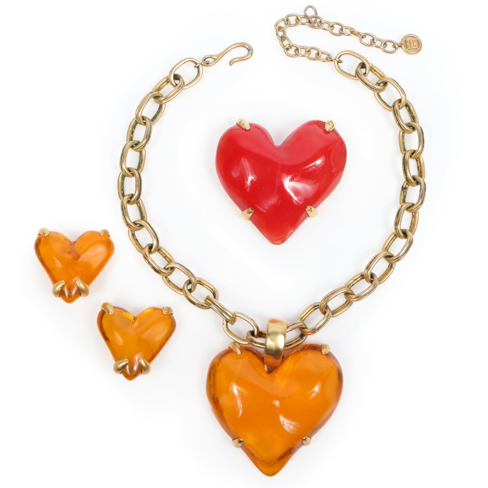 Givenchy lucite acrylic parure; heart necklace, brooch pin and earrings with gold tone hardware: Givenchy lucite acrylic parure; heart necklace, brooch pin and earrings with gold tone hardware Provenance: From the private collection of Dr. Claudia Brodhead 21"Long x 3"Pendant drop