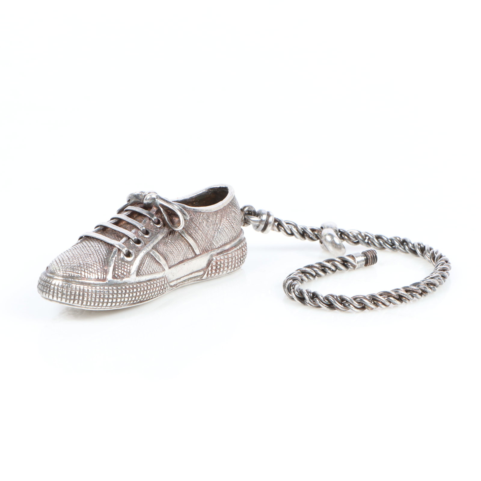 Tiffany & Co. sterling silver tennis shoe keychain charm 3/4"H x 2 1/2"W x 3/4"D(shoe measured), 5: Tiffany & Co. sterling silver tennis shoe keychain charm Missing pieces. 3/4"H x 2 1/2"W x 3/4"D(shoe measured), 5 1/2"Chain length