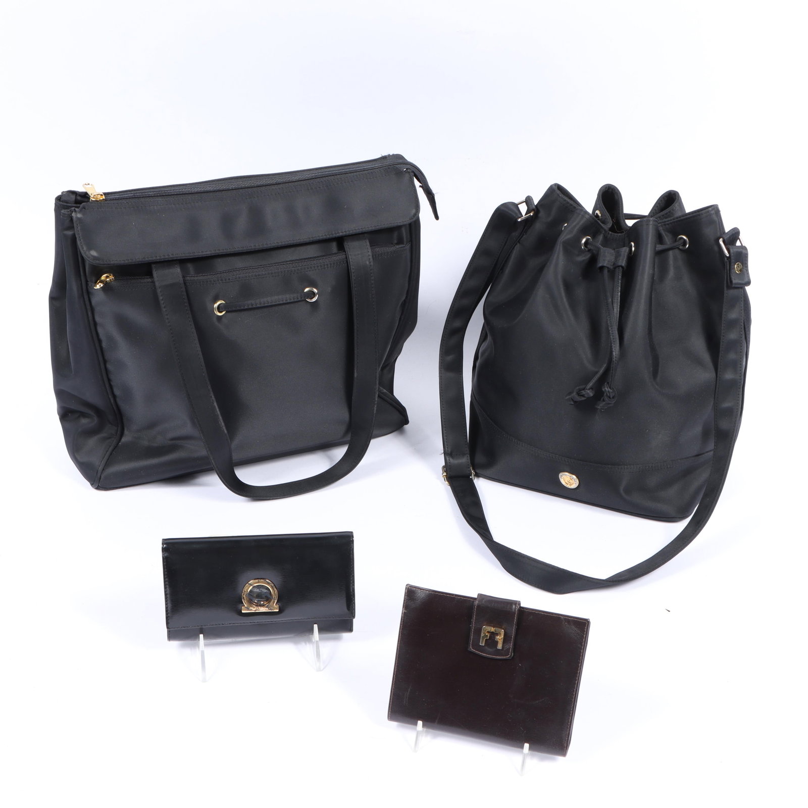 Collection of Designer itmes including two Pierre Cardin black nylon bags and two Salvatore: Collection of Designer itmes including two Pierre Cardin black nylon bags and two Salvatore Ferragamo wallets. Brown wallet shows wear and use. 14 1/2"H x 13 1/2"W(body), 10 1/2"Strap drop - tote meas