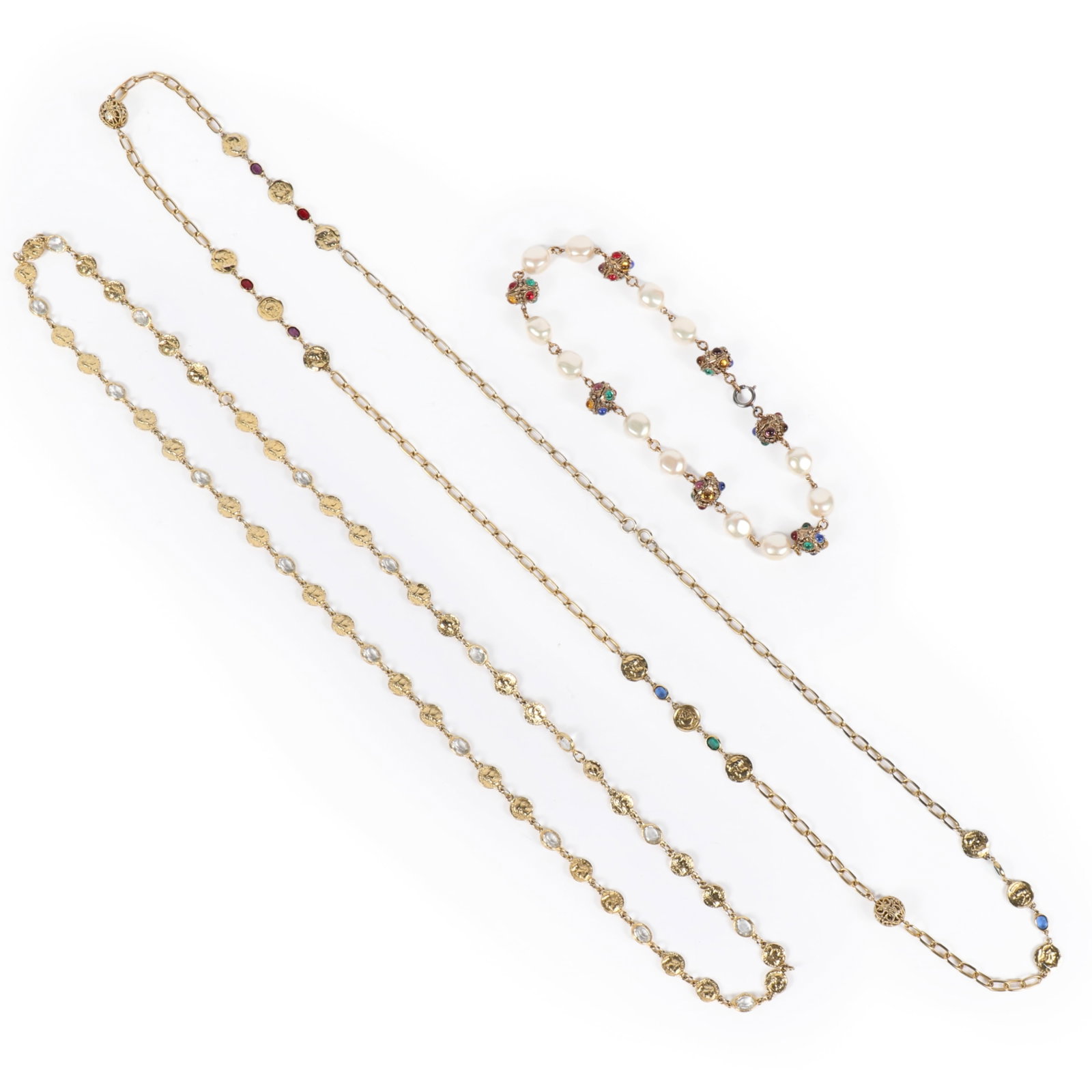 Designer 3pc. gold tone and tri-color jewel costume jewelry; two opera length coin medallion chain: Designer 3pc. gold tone and tri-color jewel costume jewelry; two opera length coin medallion chain necklaces, and a choker with multi jewel Mughal style beads and pearl stations. 18 3/4"L shortest nec
