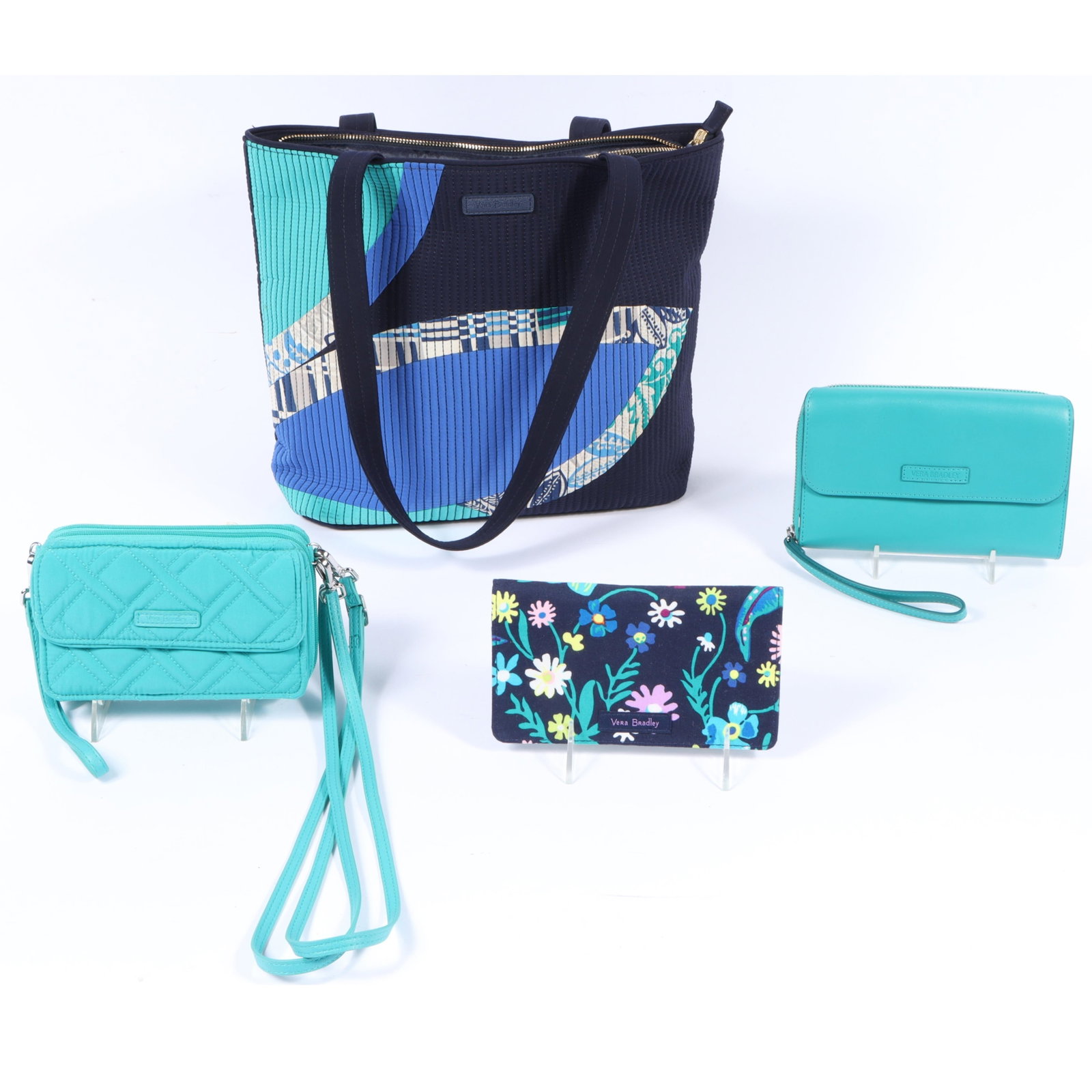 Vera Bradley collection of 4 bags including a quilted tote bag and four wallet clutches 11"H x: Vera Bradley collection of 4 bags including a quilted tote bag and four wallet clutches 11"H x 15"W(body), 12"Strap drop - tote bag measured