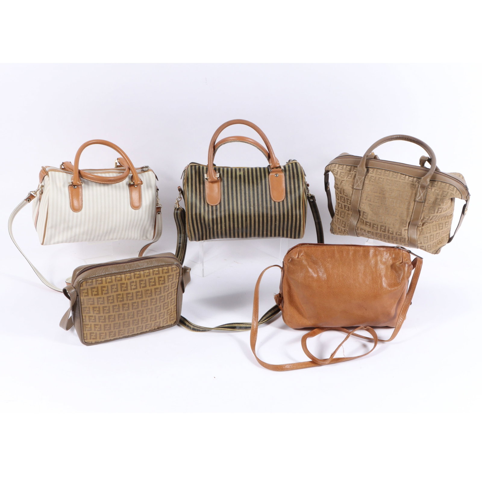 5pc. Fendi bag collection; AS IS. 7"H x 11"W x 6"D(body), 5"Handle drop, 21"Shoulder strap drop: 5pc. Fendi bag collection; AS IS.Included is a a vintage tan Fendi Zucca canvas Boston bag featuring repeating FF monogram pattern and brown leather trim, a brown leather crossbody bag, a vintage brow