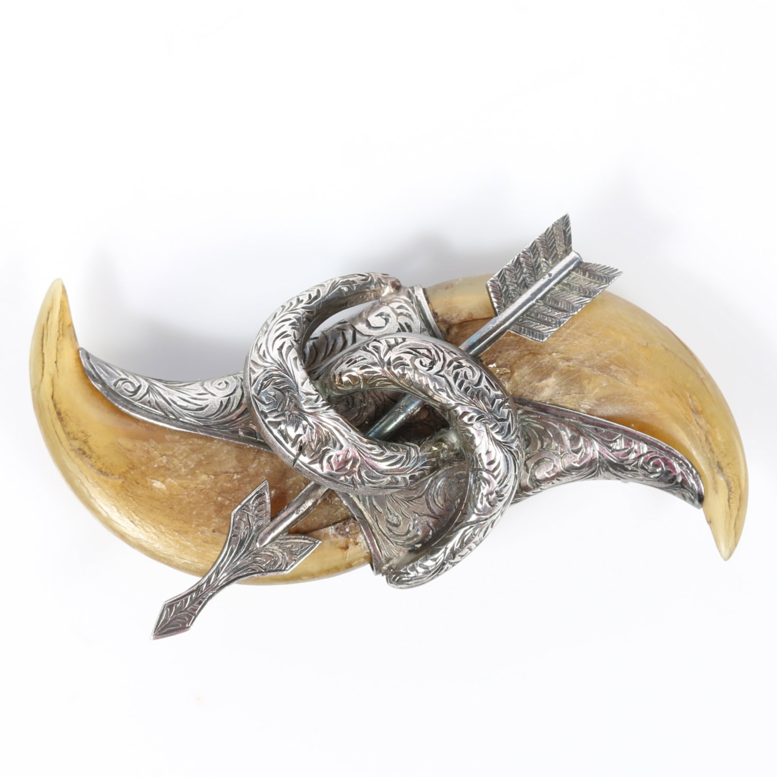 Victorian double tiger claw brooch set in etched silver with arrow detail 1 1/2"H x 2 1/2"W: Victorian double tiger claw brooch set in etched silver with arrow detail Provenance: From the collection of Sue Rudman, owner of Antique Source, Ltd in NYC for more than 45 years. 1 1/2"H x 2 1/2"W