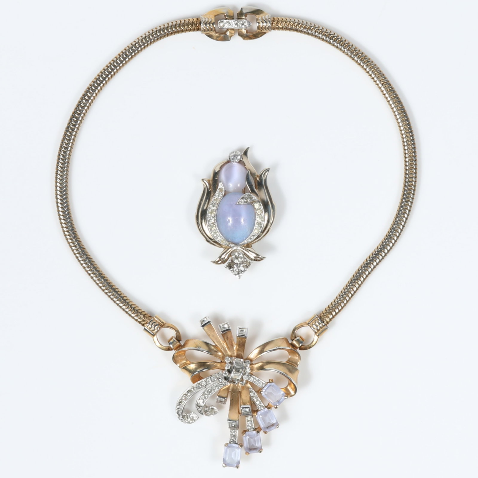 Retro 2pc jewelry group: Jomaz moonglow and pave rhinestone crystal fur clip, and Mazer ribbon and: Retro 2pc jewelry group: Jomaz moonglow and pave rhinestone crystal fur clip, and Mazer ribbon and bow necklace featuring pale lilac crystals accents and diamante rhinestones, unsigned There's some we