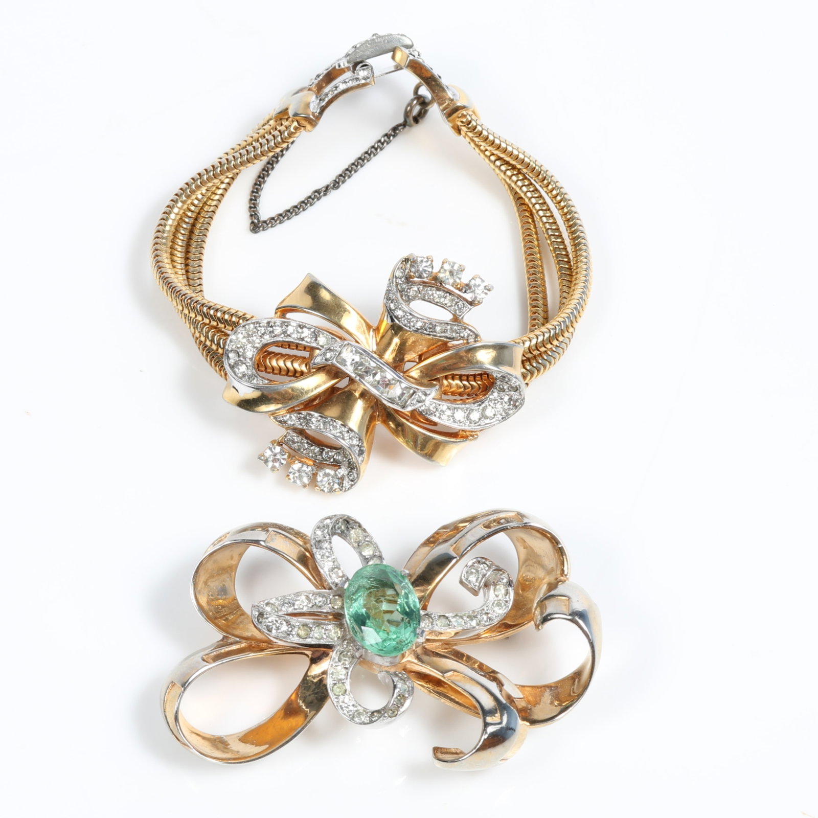 Mazer 2pc group: brooch with pave rhinestones and oval seafoam green center jewel and ribbon bow: Mazer 2pc group: brooch with pave rhinestones and oval seafoam green center jewel and ribbon bow triple strand snake chain bracelet with pave buckle Possible replaced safety chain 2 1/2"H x 1 3/8"W (b