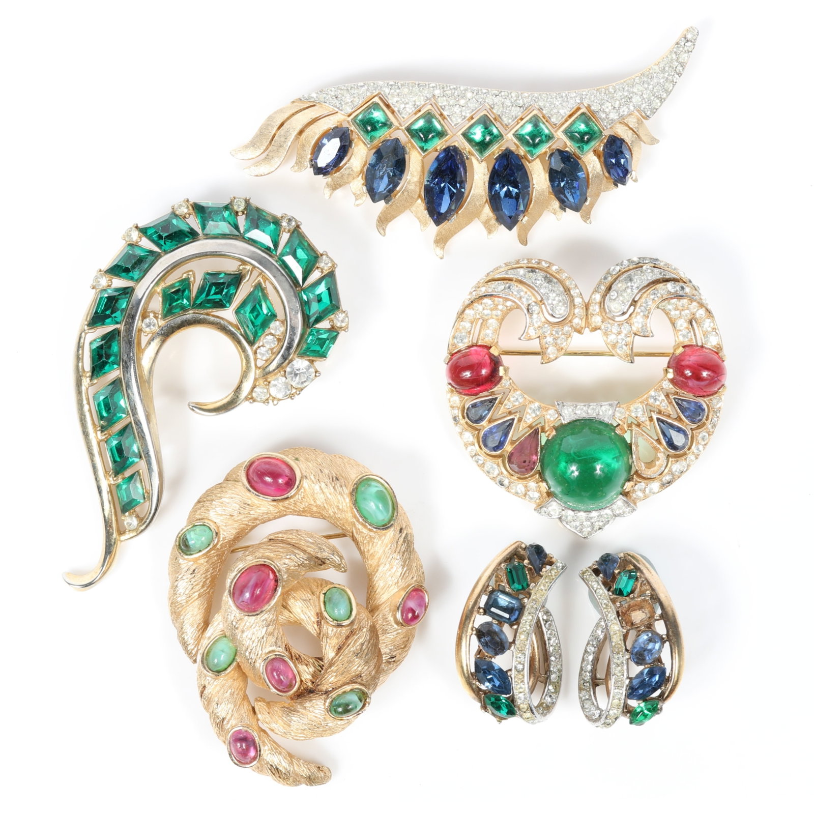Trifari Moghul Jewels of India 5pc group: coil brooch with green and red art glass cabochons, heart: Trifari Moghul Jewels of India 5pc group: coil brooch with green and red art glass cabochons, heart brooch with large swirl cabochon, feather brooch and matching earrings, and green jewel swirl brooch