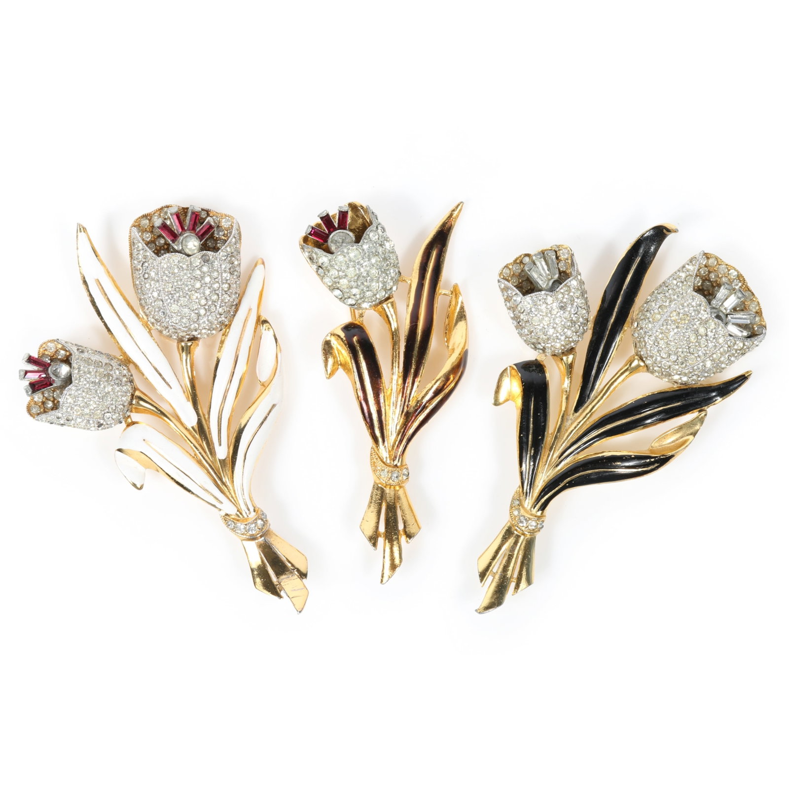 Coro Adolf Katz 1939 pair of double, and one single tulip flower trembler brooches with pave: Coro Adolf Katz 1939 pair of double, and one single tulip flower trembler brooches with pave rhinestones, gold wash, and white, black, and bronze enamel leaves, unsigned Provenance: From the Collectio