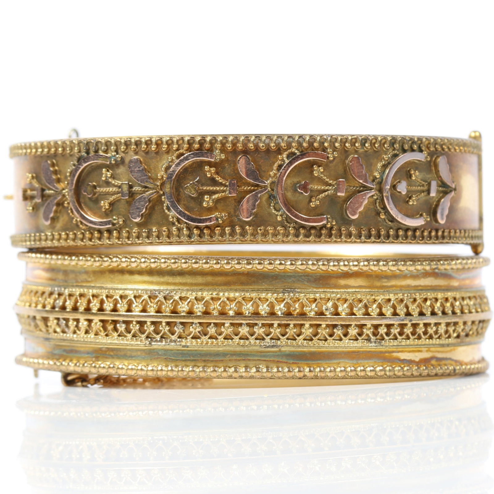 Pair of Victorian Etruscan Revival gold filled hinged bangle bracelets 2 1/2"W x 2 1/8"Tall x 1/2"W: Pair of Victorian Etruscan Revival gold filled hinged bangle bracelets Provenance: From the collection of Sue Rudman, owner of Antique Source, Ltd in NYC for more than 45 years. 2 1/2"W x 2 1/8"Tall x