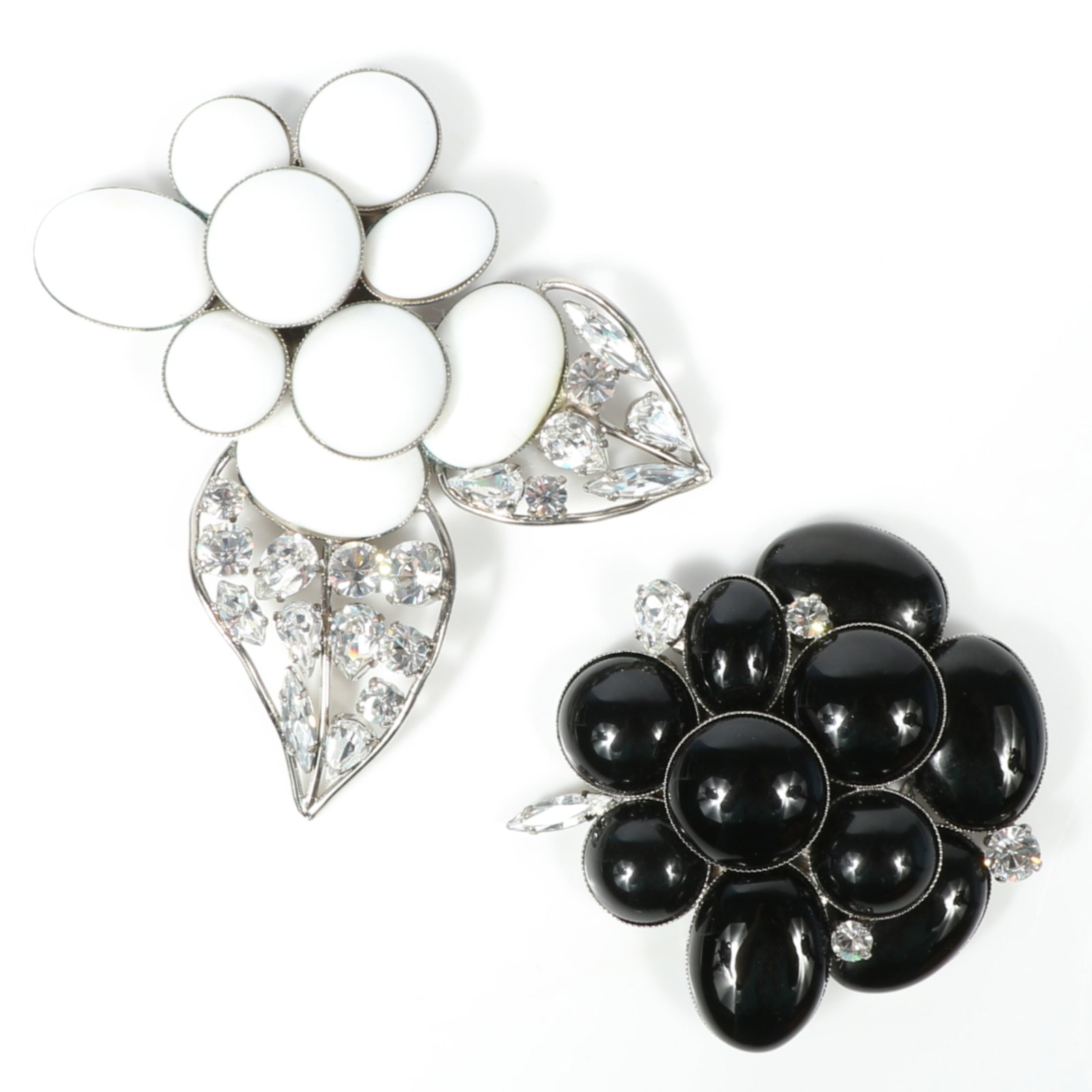Philippe Ferrandis Paris 2pc black and white floral Camellia poured glass brooch group accented with: Philippe Ferrandis Paris 2pc black and white floral Camellia poured glass brooch group accented with diamante crystals Provenance: From the private collection of Dr. Claudia Brodhead 4"L x 3 3/4"W (wh