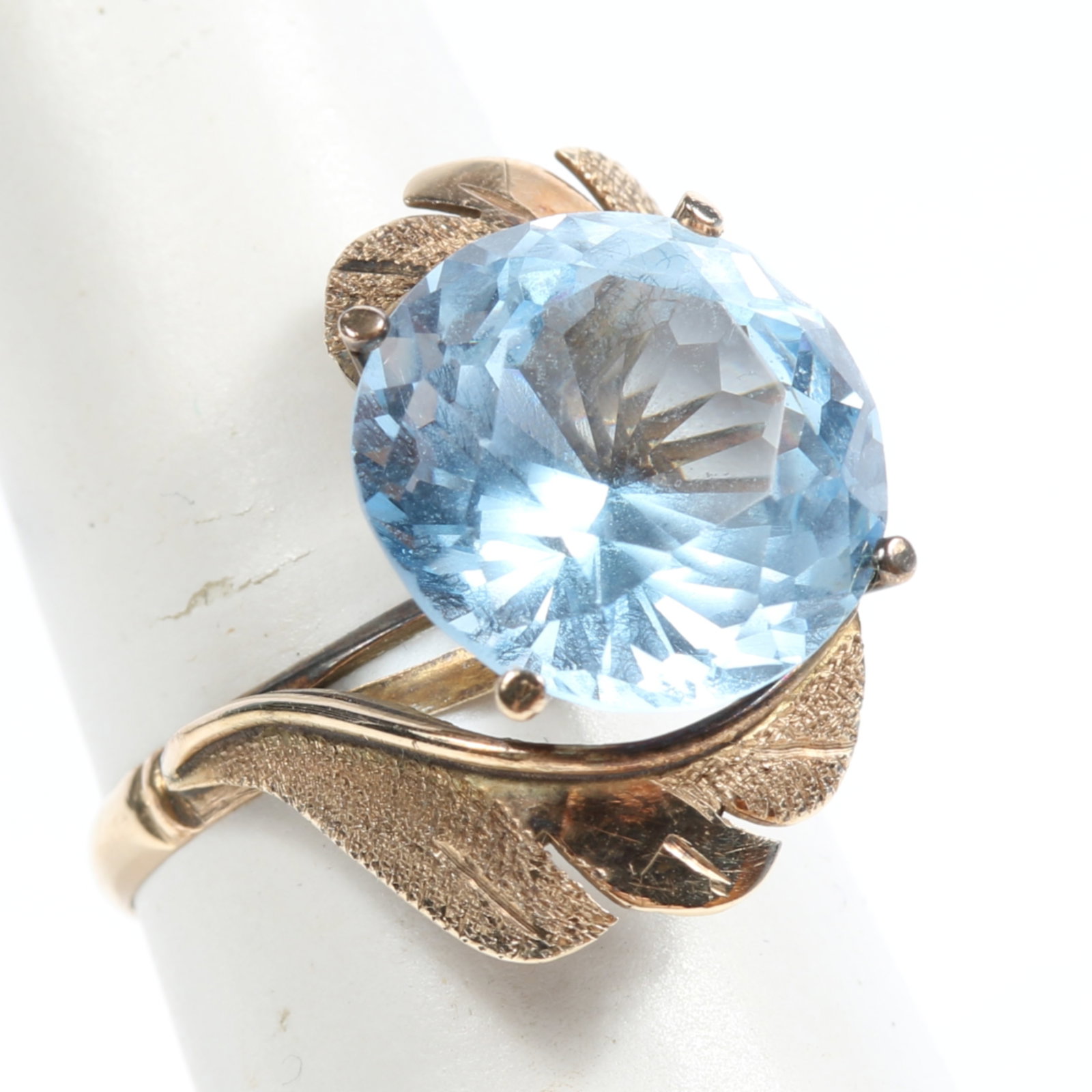 14k Yellow gold blue topaz floral bypass ring Size 7 3/4: 14k Yellow gold blue topaz floral bypass ring 3.12 dwt. The purchase of gold requires confirmed funds. Size 7 3/4