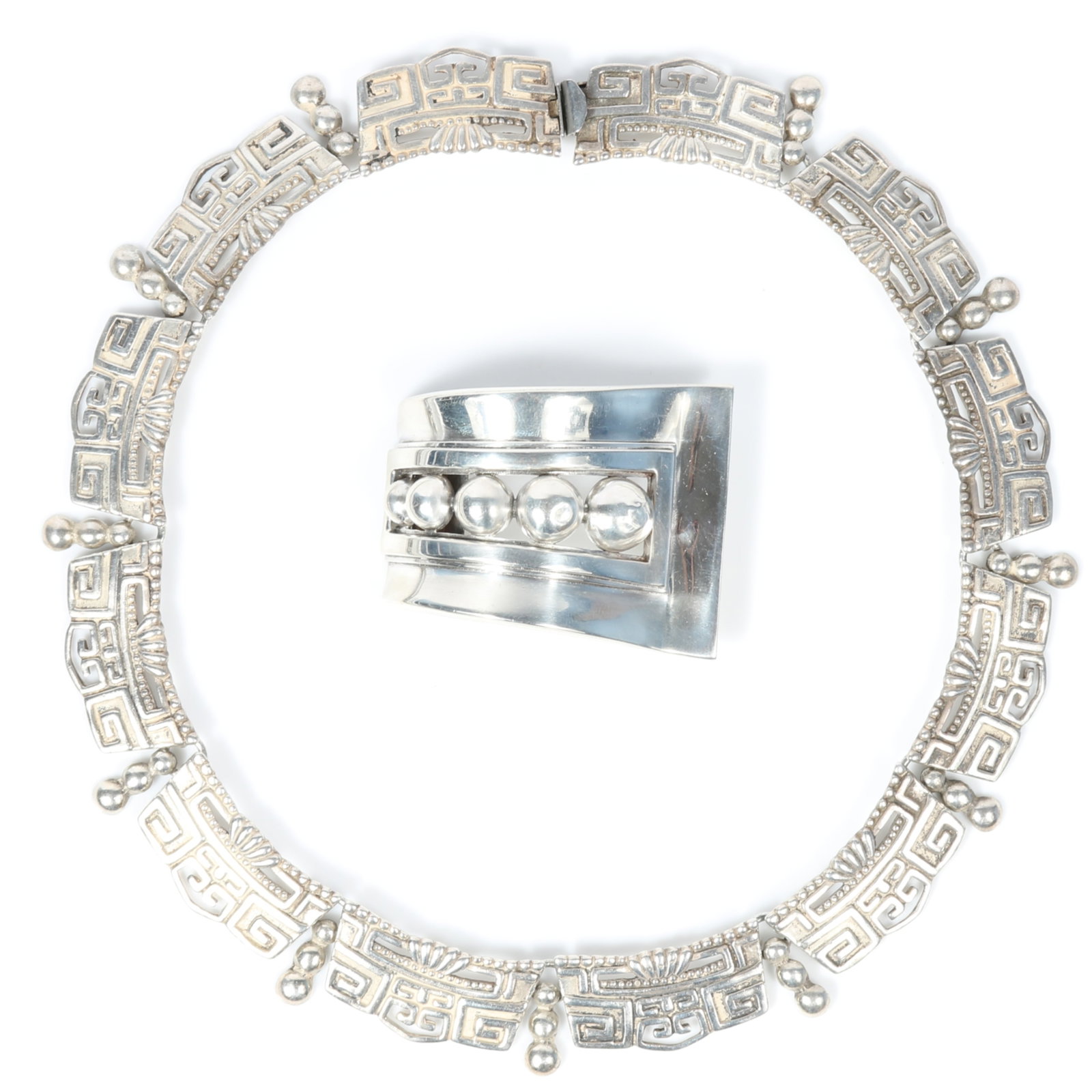 Margot de Taxco 2pc group: sterling silver pre Columbian style necklace with Modernist ribbon ball: Margot de Taxco 2pc group: sterling silver pre Columbian style necklace with Modernist ribbon ball brooch Necklace #5820, brooch #5247 Provenance: From the Collection of Joan Duran, owner of The Queen