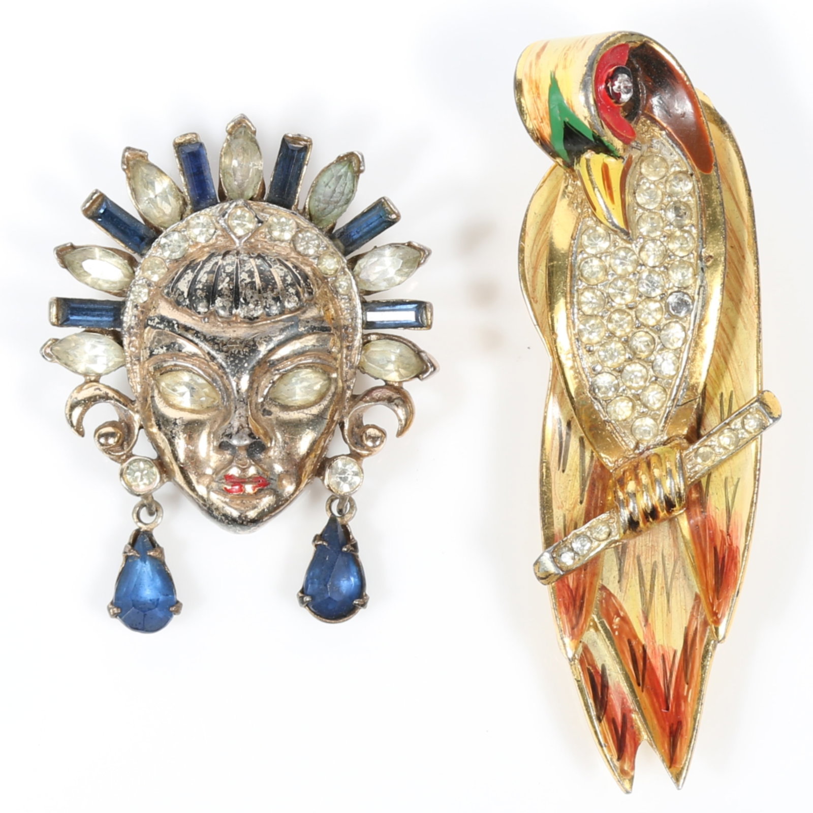 Coro sterling vermeil 2pc figural group: enamel and pave rhinestone parrot fur clip and Siren mask: Coro sterling vermeil 2pc figural group: enamel and pave rhinestone parrot fur clip and Siren mask fur clip with blue and diamante rhinestones, both unsigned book pieces Wear to vermeil on Siren Ameri