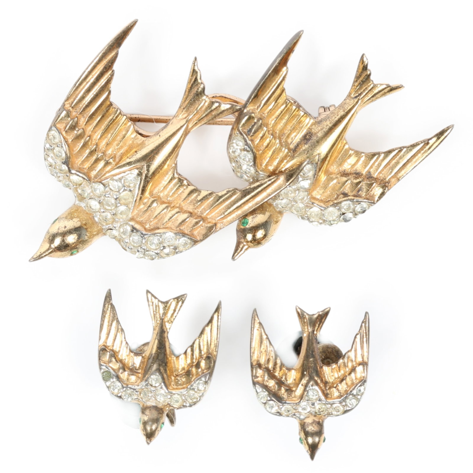 Coro Craft / Corocraft sterling vermeil swooping swallows birds duette with green eyes, pave, and: Coro Craft / Corocraft sterling vermeil swooping swallows birds duette with green eyes, pave, and matching earrings Some wear to vermeil One earring is missing one clear stone. 2 1/4"H x 2"W (brooch)
