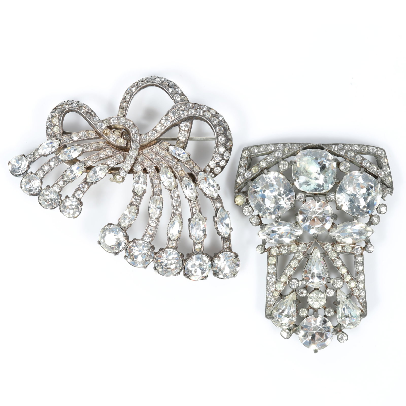 Pair of Eisenberg Original diamante rhinestone brooches, including spray brooch with setter's mark,: Pair of Eisenberg Original diamante rhinestone brooches, including spray brooch with setter's mark, and shield form converted dress clip brooch several gems missing (Right) Provenance: From the Collec