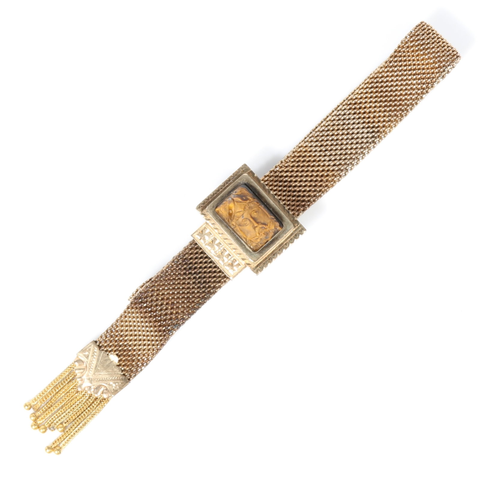 Victorian gold filled mesh adjustable slide bracelet with tassels and carved tiger's eye cameo: Victorian gold filled mesh adjustable slide bracelet with tassels and carved tiger's eye cameo depicting a crowned and bearded figure Provenance: From the collection of Sue Rudman, owner of Antique So