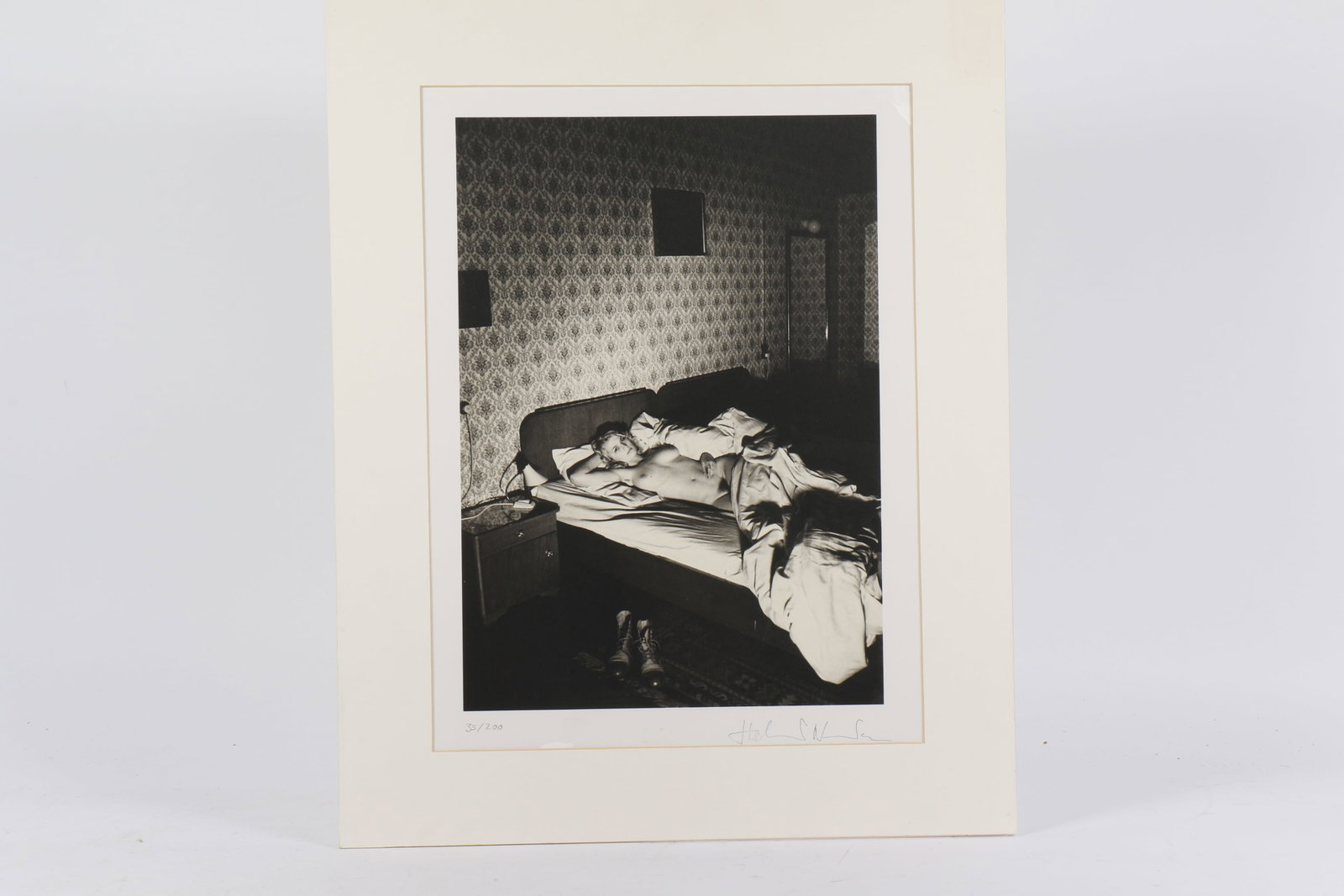Helmut Newton, German (1920-2004), reclined female nude, photographic print, 13 3/4"H x 9 3/4"W: Helmut Newton German (1920-2004) reclined female nude photographic print Ink signed lower right, numbered 35/200. Biography from the Archives of askART: Helmut Newton, born Helmut Neust?dter, was born
