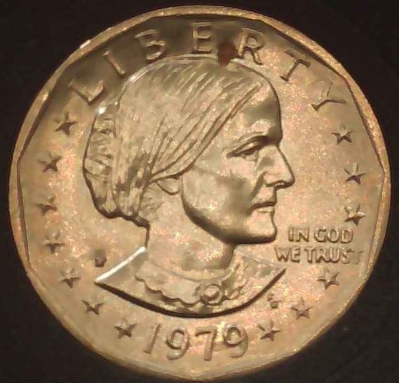 UNITED STATES 1979-D SUSAN B ANTHONY ONE DOLLAR: Anthony Dollar was the first time that a woman appeared on a U.S. circulating coin. The coin replaced the Eisenhower Dollar and was minted from 1979-1981 and again in 1999. It honored women's suffrage
