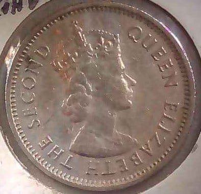 BRITISH CARIBBEAN TERRITORIES 1964 TEN CENTS: Features Issuer Eastern Caribbean States Queen Elizabeth II (1952-2022)Type Standard circulation coin Years 1955-1965 Currency British West Indies dollar (1935-1965) Composition Copper-nickel (75% Cop