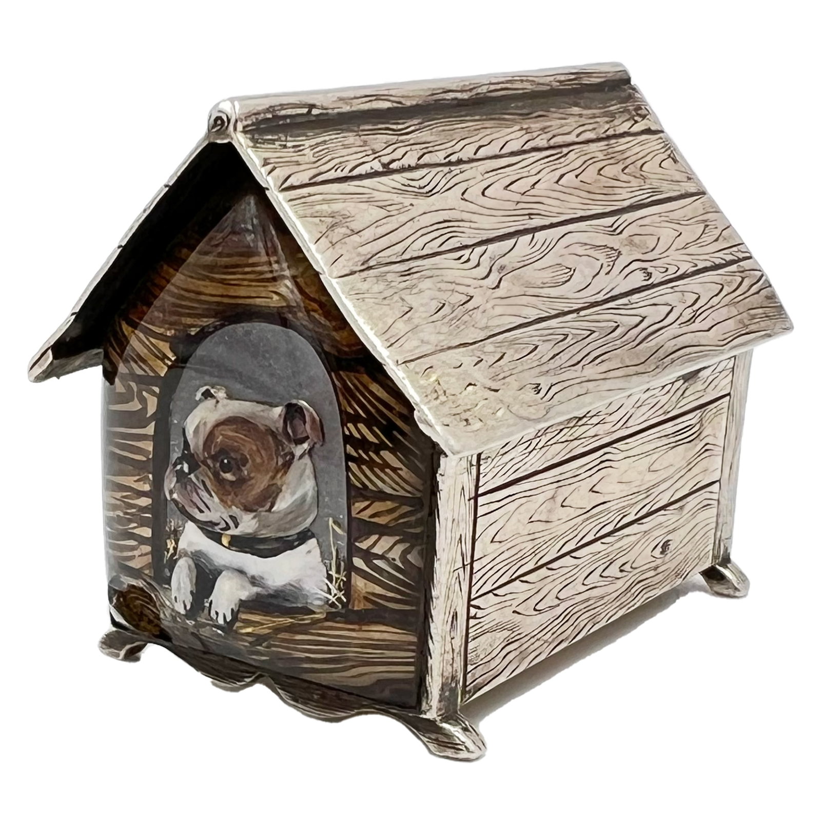 A RARE SILVER AND ENAMEL “DOG IN KENNEL” VESTA CASE WITH OPENING DRAWER, LONOND, 1881: A rare silver and enamel “dog in kennel” vesta case with opening drawer.THOMAS JOHNSON I RETAILING BY W.THORNHILL AND CO, 144 BOND STREET, 1881. W :5cm, Weight: 77g