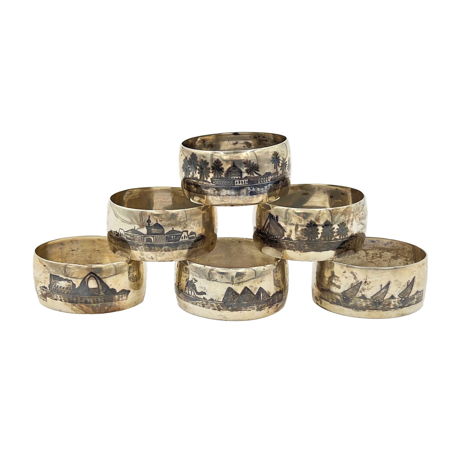 A SET OF SIX MID-20TH CENTURY IRAQI SILVER AND NIELLO NAPKIN RINGS (1 of 1)