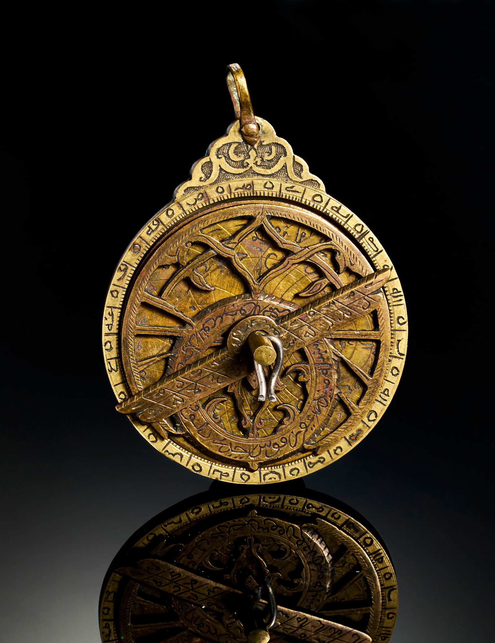 A FINE ENGRAVED QAJAR BRASS MINIATURE ASTROLABE, 19TH CENTURY (1 of 5)