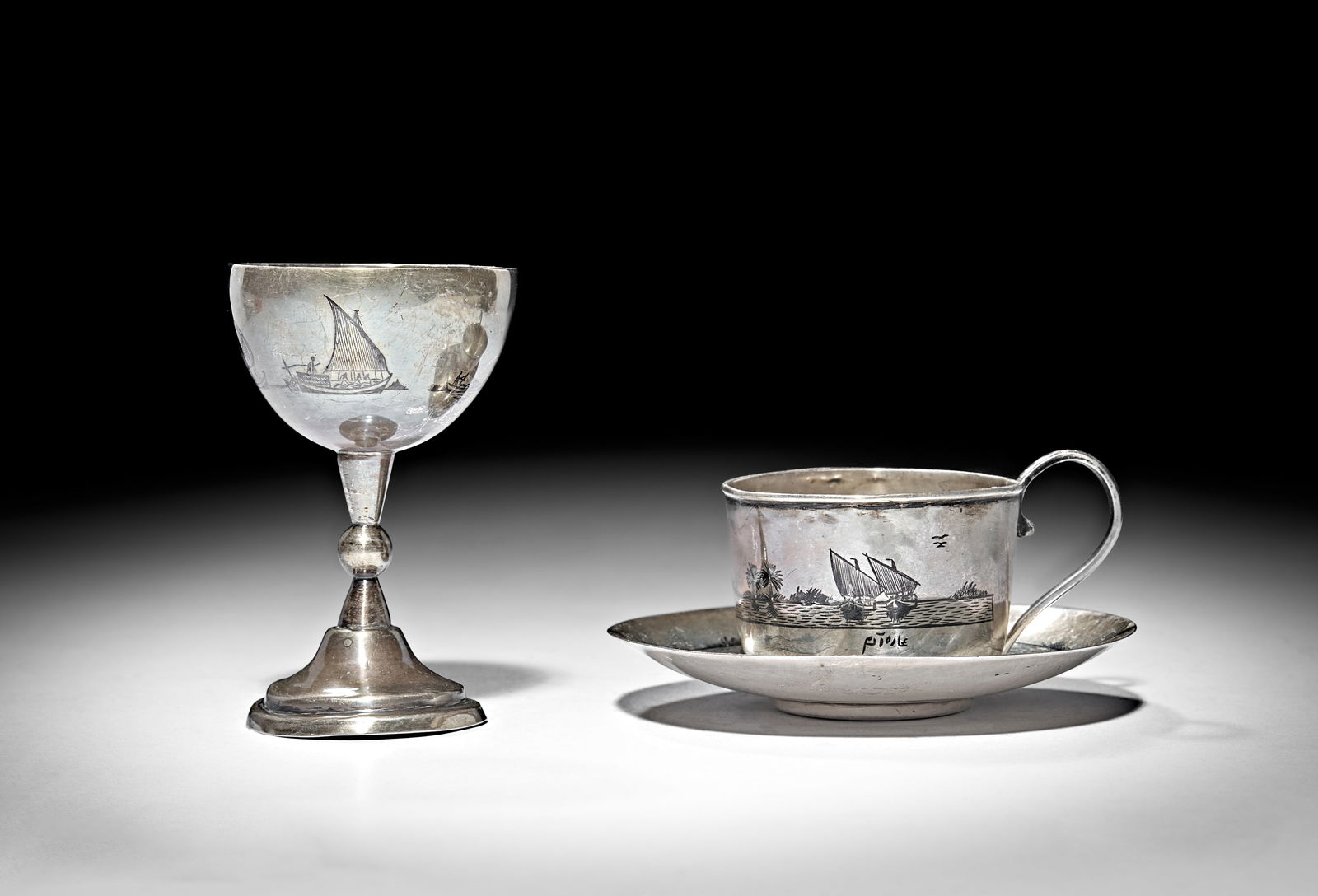 AN EARLY 20TH CENTURY IRAQI SILVER AND NIELLO COFFEE CUP, SAUCER AND EGG CUP: AN EARLY 20TH CENTURY IRAQI SILVER AND NIELLO COFFEE CUP, SAUCER AND EGG CUP Total weight: 104g 
