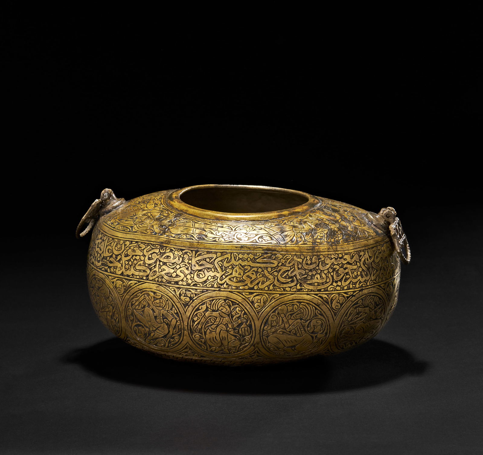 A FINE QAJAR ENGRAVED BRASS KASHKUL, PERSIA, 19TH CENTURY (1 of 6)