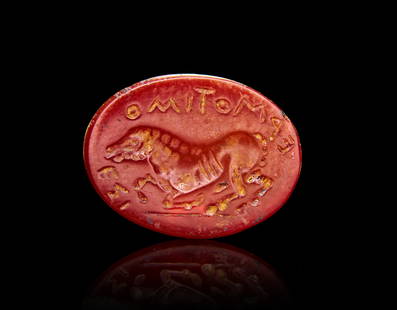 A ROMAN AGATE INTAGLIO OF A CROUCHING HORSE WITH GREEK OR ROMAN INSCRIPTIONS, 1ST - 2ND CENTURY A.D: A ROMAN AGATE INTAGLIO OF A CROUCHING HORSE WITH GREEK OR ROMAN INSCRIPTIONS, 1ST - 2ND CENTURY A.D L: 1.9cm
