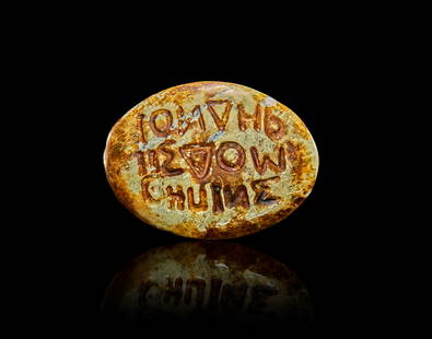 A TURQUOISE GREEK INSCRIBED AMULET RING STONE: A TURQUOISE GREEK INSCRIBED AMULET RING STONE L: 2.4cm 