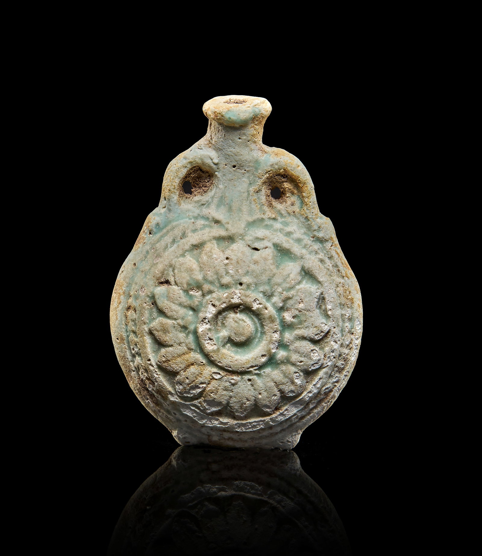 AN EGYPTIAN FAIENCE NEW YEARS FLASK, GRECO ROMAN, CIRCA 200 A.D.: AN EGYPTIAN FAIENCE NEW YEARS FLASK, GRECO ROMAN, CIRCA 200 A.D. L: 6cm, W: 4cm 